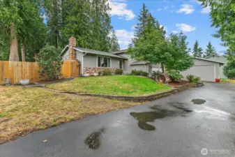 Circular driveway on almost an acre of beautiful yard.