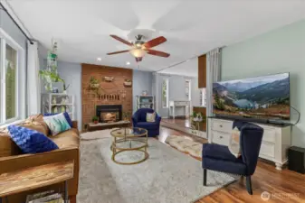 Front living area with gas fireplace and abundance light.