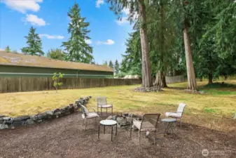 The yard also offers wood shed and 2 other storage sheds.