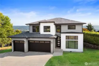 Luxurious new construction with stunning Mt. Rainier & valley views on a .50-acre corner lot. 3975 Square feet with 4 bedrooms and 4.50 bathrooms.  Enjoy a 420 sq. ft. vaulted deck plumbed for BBQ. Inside features 9' ceilings, Pecan hardwood floors, Craftsman trim, wood-wrapped windows & a 9’ x 8’ picture window. The gourmet kitchen includes quartz counters, soft-close shaker cabinets, an undermount sink, ZLINE gas cooktop, and top-tier Whirlpool stainless appliances. The primary suite offers a balcony, walk-in closet, and 5-piece bath. Upstairs boasts 4 bedrooms, a bonus room & office with closet. The finished daylight basement includes a full bath, separate entrance, is plumbed for a future kitchen, has a 400+ sq. ft. patio w/valley view & perfect for potential ADU/multi-generational living.  *Lawn virtually added