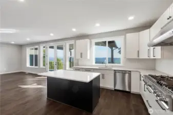 Undermount sink, shaker soft-close cabinets, ton of storage including Lazy Susans and under cabinet lighting!