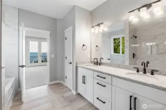 5-piece primary bathrooms with Moen Gibson bath fixtures, floor to ceiling ceramic tile shower wih double shower head, soaking tub, undercount double sinks, quartz counters, and ceramic tile floors.