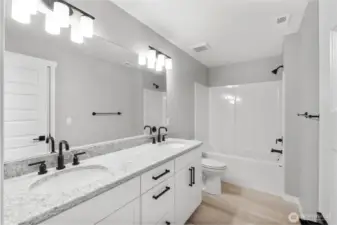 All bathrooms feature quartz counters and Moen Gibson bath fixtures.