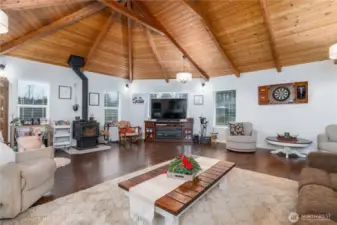 Spacious great room with newer woodstove and Oak hardwood flooring