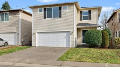 Architectural presence meets refined curb appeal—this impeccably maintained home makes a statement before you ever step inside.