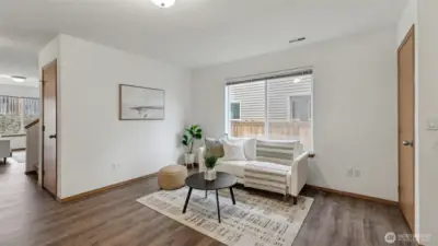 A polished yet comfortable living area with an open flow to the dining room, creating a seamless main-level experience.