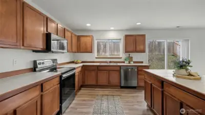 Designed for both beauty and function, this kitchen offers abundant counter space and generous storage to support everyday living and entertaining.
