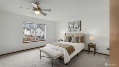 Generous in size with refined details, this primary bedroom offers a peaceful sanctuary at the heart of the home.