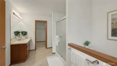 Spacious and serene, this primary bath offers a tranquil retreat with ample room to add floating shelves or a small pantry for personalized storage.