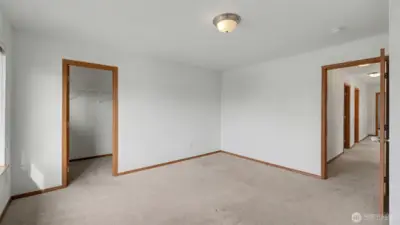 Well-appointed with ample closet space, this bedroom combines functionality and style for family or guests.