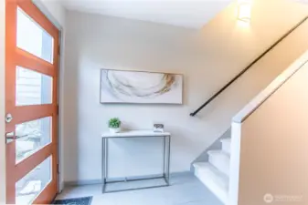 Spacious Entry.  Bedroom on the Main Floor (Entry Level) currently staged as a Home Office.  There is also a Full Bath on the Main Floor.