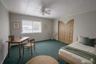 Bedroom 1.  Digitally staged for illustration purposes.