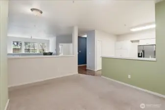 This is from the dining room looking out to the living room and kitchen.  In this picture you can see the additional pantry to the left of the refrigerator.