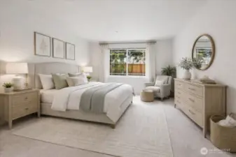 This is the primary bedroom.  It is very spacious. It can easily accommodate a king sized bed plus furniture.  This photo has been virtually staged.