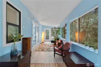 Sunroom with deck and backyard access