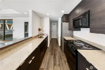 Clean lines and refined finishes support the kitchen’s role as both workspace and gathering point within the penthouse.