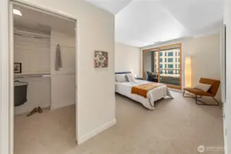 The bedroom suite connects to a dedicated dressing area and walk in closet.
