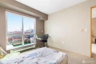 Primary bedroom with oversized closet and East-facing city views