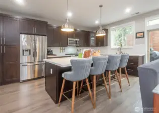 Quartz Countertops, soft close cabinets and incredible storage. Notice the cabinet in this island kitchen.