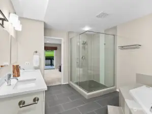 Fully tiled walk-in shower and jetted tub