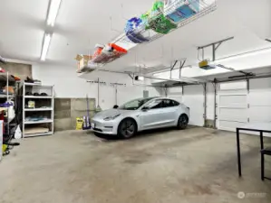 Oversized 2 car garage with storage. Pre-wired for EV charging