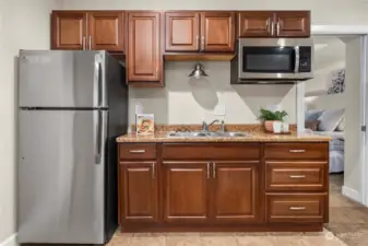 Quaint kitchen with Refrigerator and Microwave