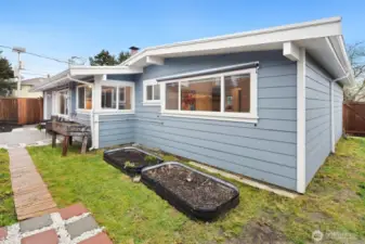 Property has plenty of garden space to personalize the yard.