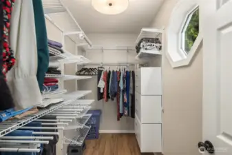 Walk-in closet spacious enough to function as a dedicated styling room.