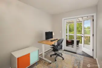 The second bedroom boasts a private entrance to the upper deck, offering seamless indoor-outdoor living.