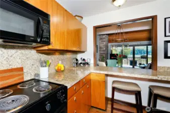 This clever condo opened has bar seating inside the kitchen so you can look at the view while you enjoy a meal.