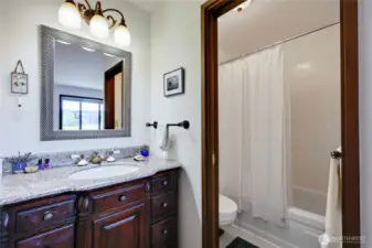 The updated, full bathroom in the primary ensuite.