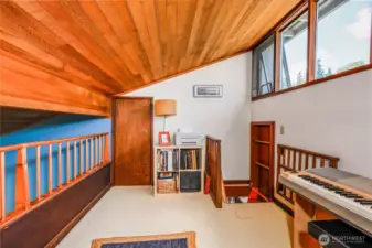 The loft space can be used for a den, music room, extra sleeping space or whatever you like. And there's a large storage room behind the door on the left - Bonus!