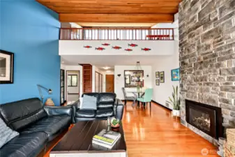 This particular condo has a loft and a bonus storage room! The stone wall is custom and the fireplace is propane.