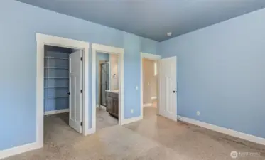 3rd bedroom and homes second primary, on upper floor with attached bath.