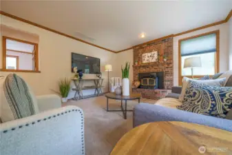 Another view of the family room with woodburning fireplace/stove.
