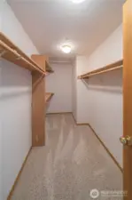 Spacious primary walk-in closet.