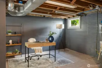 Lower level, heated basement is versatile space perfect for a stylish and productive home office setup.