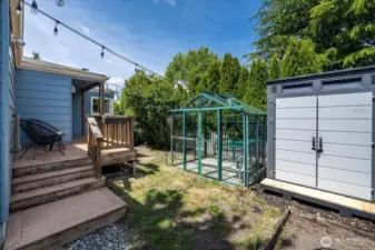 Greenhouse for the home gardener and storage shed next to conveniently store your gardening tools!