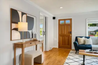 As you enter, gorgeous hardwoods greet you throughout the home!