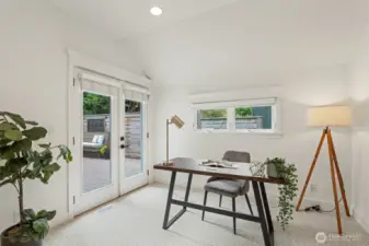 Main floor bedroom works great as an office or guest space and walks out to the deck.