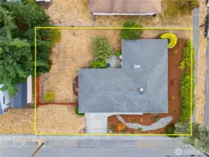 Spacious corner lot and private, fenced yard ideal for entertaining, pets, and raised beds.
