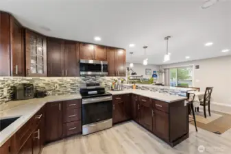 Bright, stylish kitchen with quartz counters and clean, contemporary lines.
