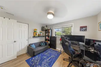 Flexible guest bedroom or gaming room featuring two closets.