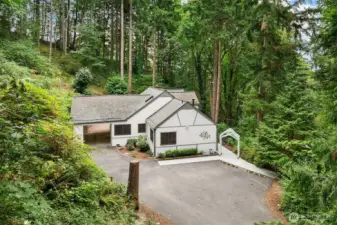 Surrounded by nature, 4 beds plus office/den.