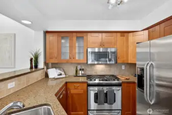 Kitchen with granite countertops and plenty of storage space