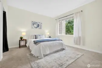Primary bedroom is spacious enough for a king bed