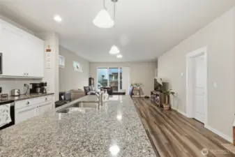 Open concept kitchen/dining/living room.