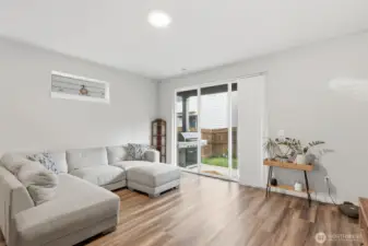 Lots of natural light in the living room, patio and back yard