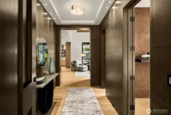 Warm entry foyer with curated art lighting.