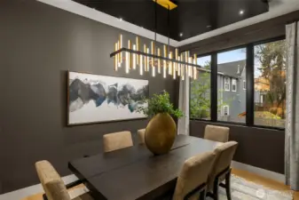 Warm and intimate dining room with Walnut wood ceiling paneling.